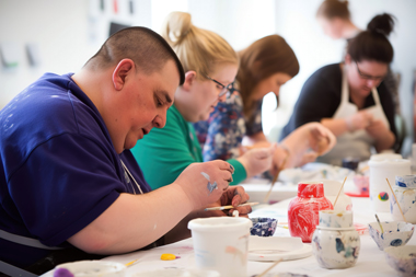 adults with supported needs painting pottery