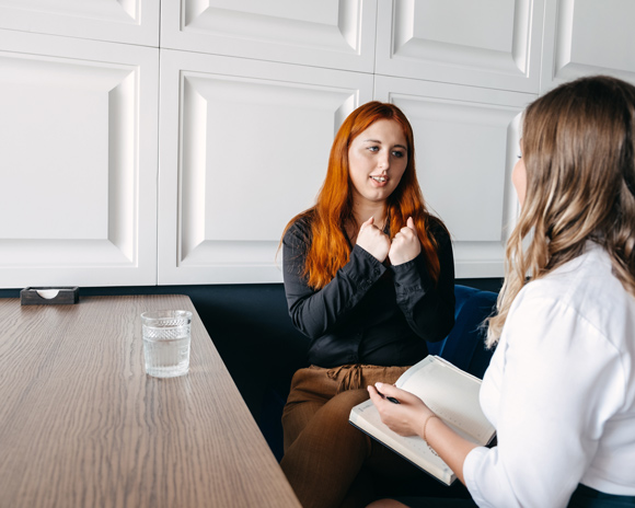 woman opening up confidently to therapist about mental health problems